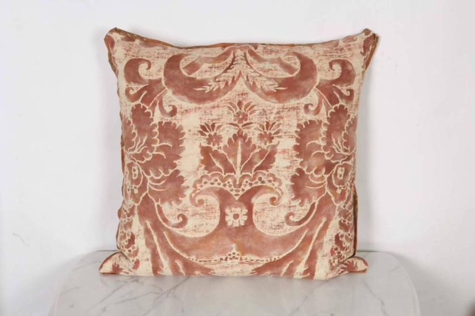 A pair of Fortuny fabric cushions in the Glicine pattern, caramel and white color way, cotton-linen blend backing material and striped silk bias edging, the pattern, 17th century Italian design with Wisteria motif. Newly made using vintage Fortuny