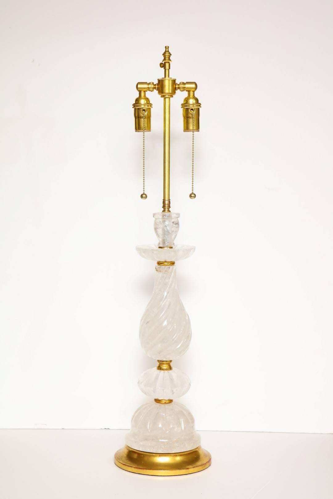 A new rock crystal table lamp, swirl glass design with giltwood elements, double cluster fitting.