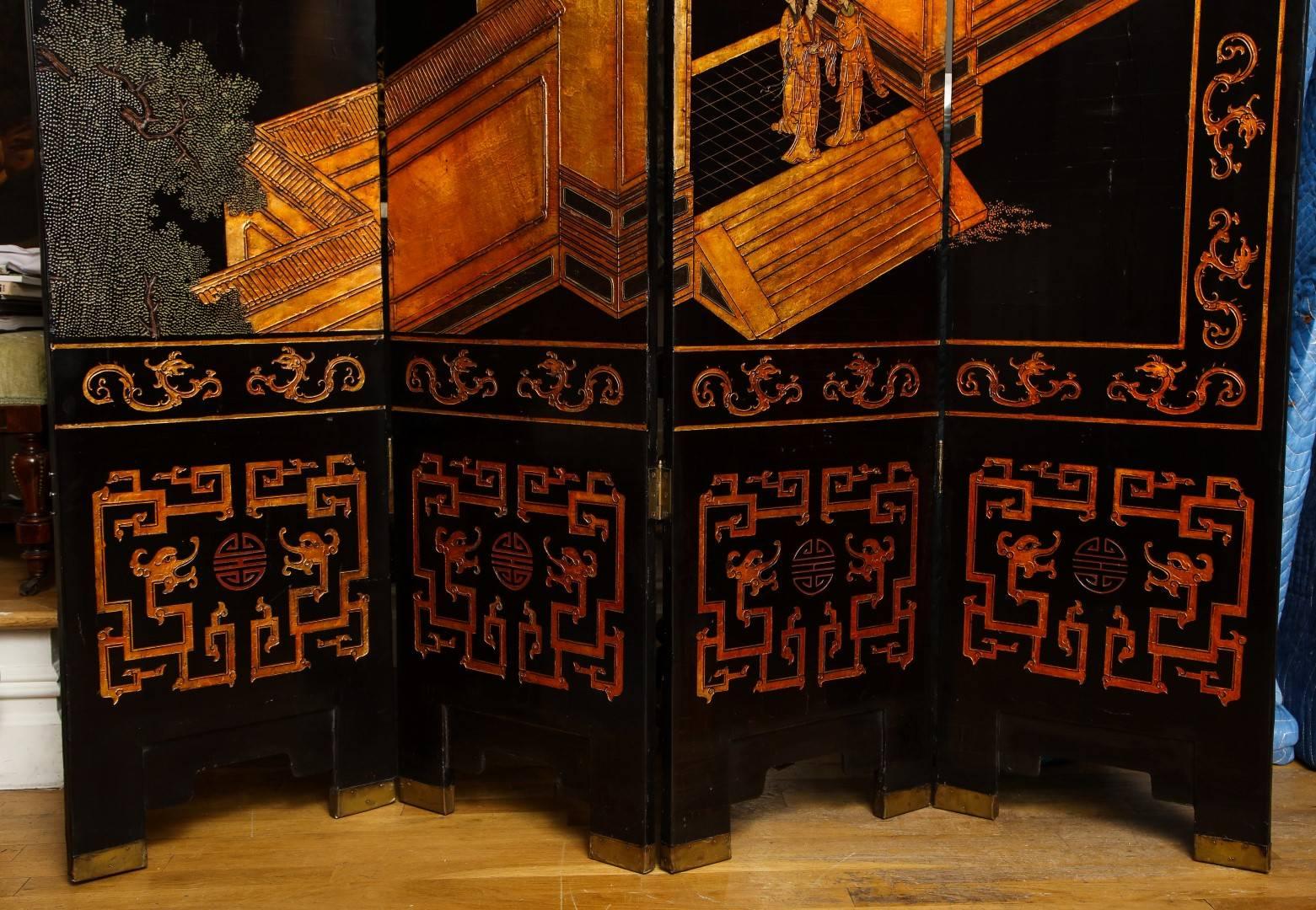 An impressive Chinese Coromandel screen, the eight double sided decorated panels displaying a black lacquered ground with incised radiant gold decoration, depicting a village with figures at leisure, the reverse with delicate cranes.
   