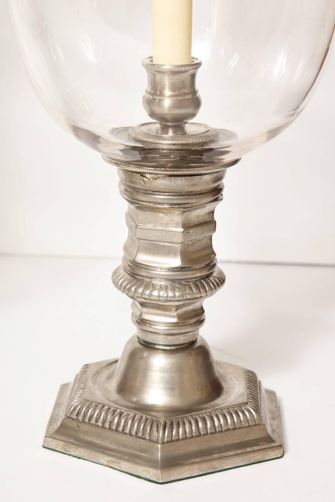 A pair of antique silver plated hurricane candleholders.