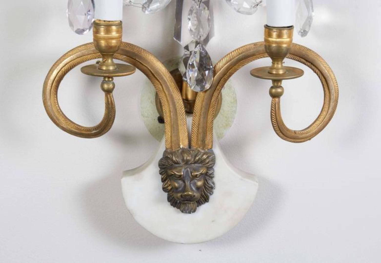 A pair of exceptional 18th century Baltic gilt bronze and crystal beaded sconces, of Neoclassical style, the white marble plinth form base with bronze lion mask mount issuing 2 arched candle arms, the base supporting a central crystal obelisk stem