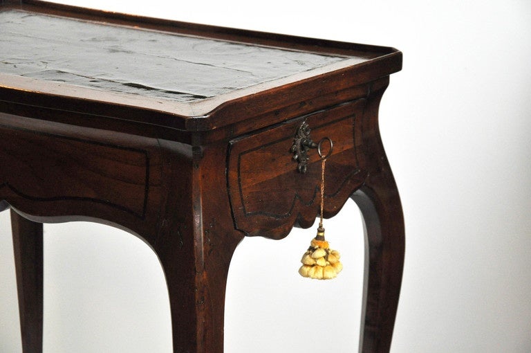 Walnut Louis XV Leather Top Writing Table, Signed J.P. Latz
Single Drawer with Simple Ebony Stringing. Gilt Bronze Mounts with Original Lock and Key.