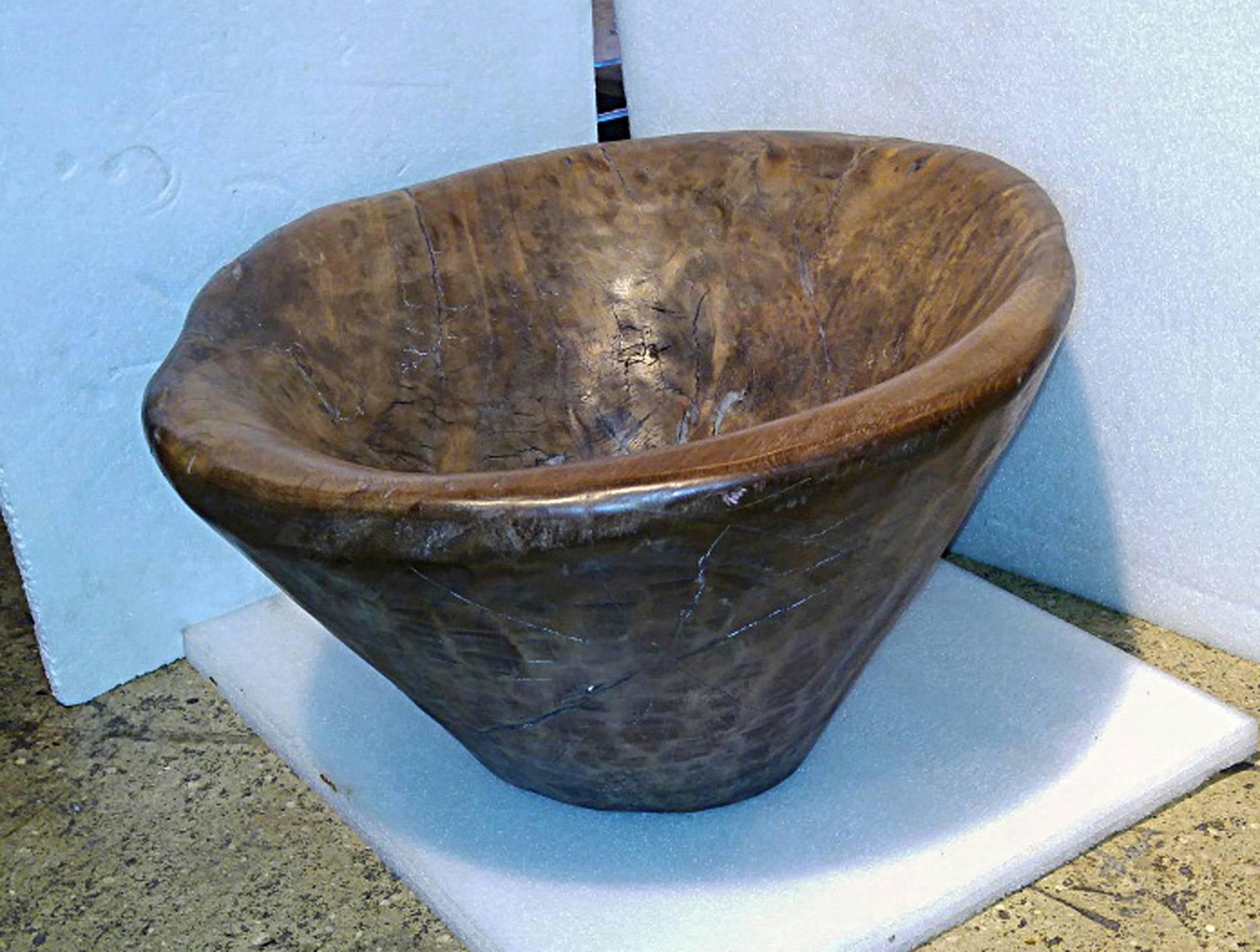 A large hand-carved teakwood bowl from Indonesia. A one-of-a-kind centrepiece for your table or shelf. Other similar bowls available.