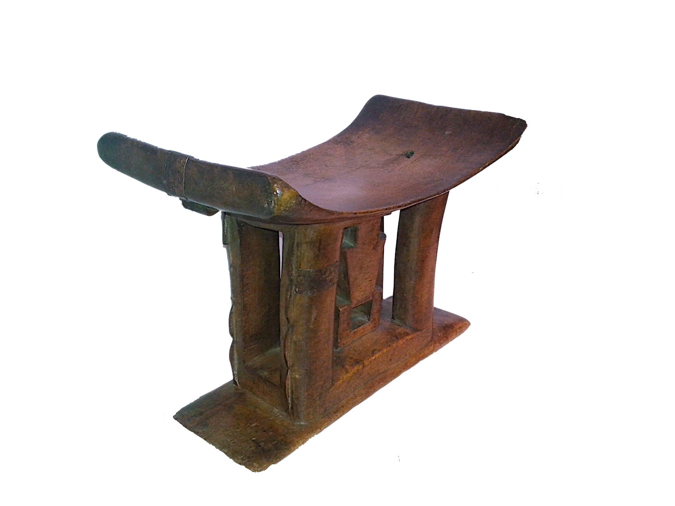 An Ashanti stool, a traditional carved personal seat from Ghana, mid-20th Century. Hand-carved from a single piece of wood. Use as a low end table, stand or stool.