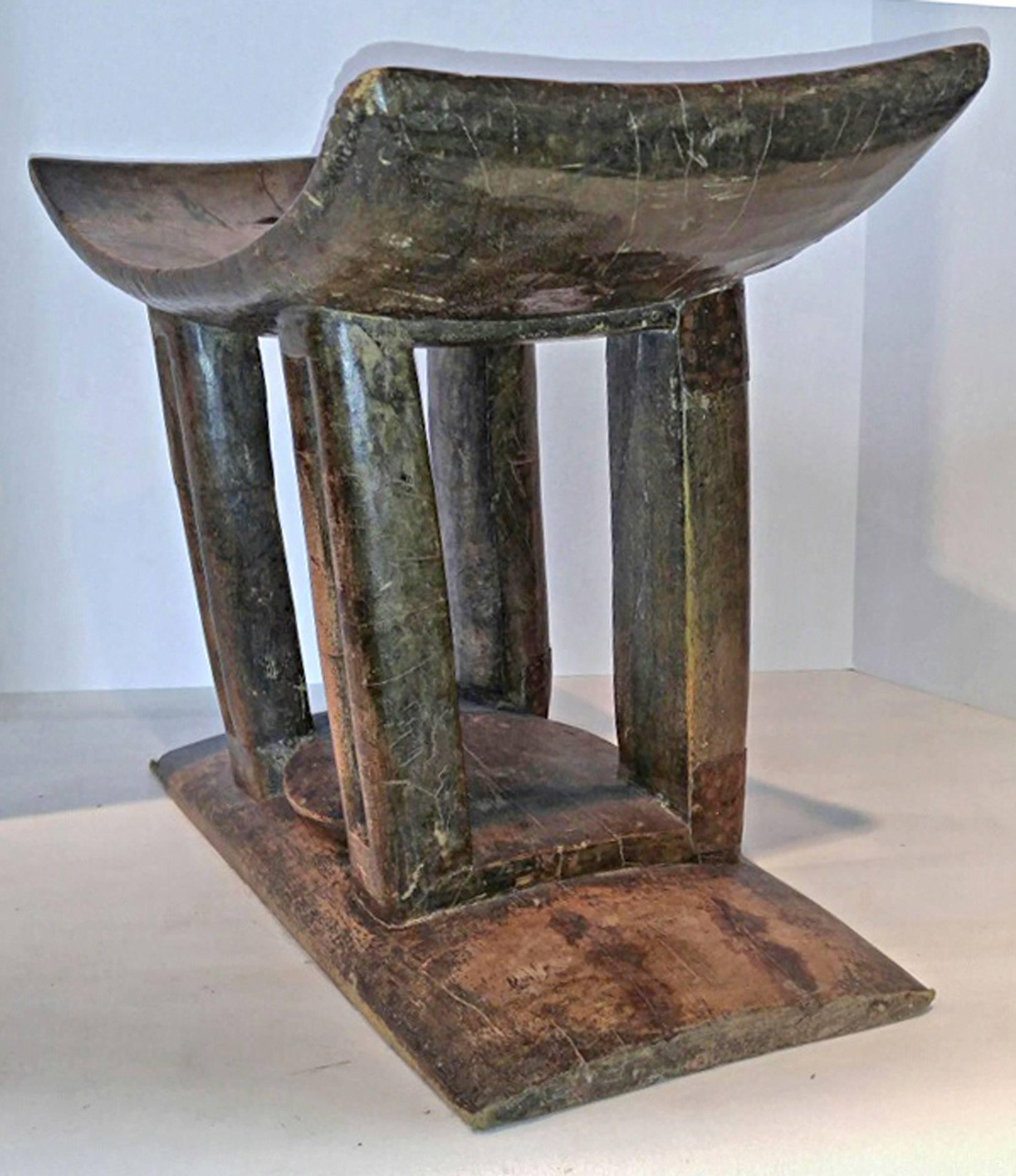 An Ashanti stool, traditional carved personal seat from Ghana. Carved from a single piece of wood. Use as a low end table, stand or seat.