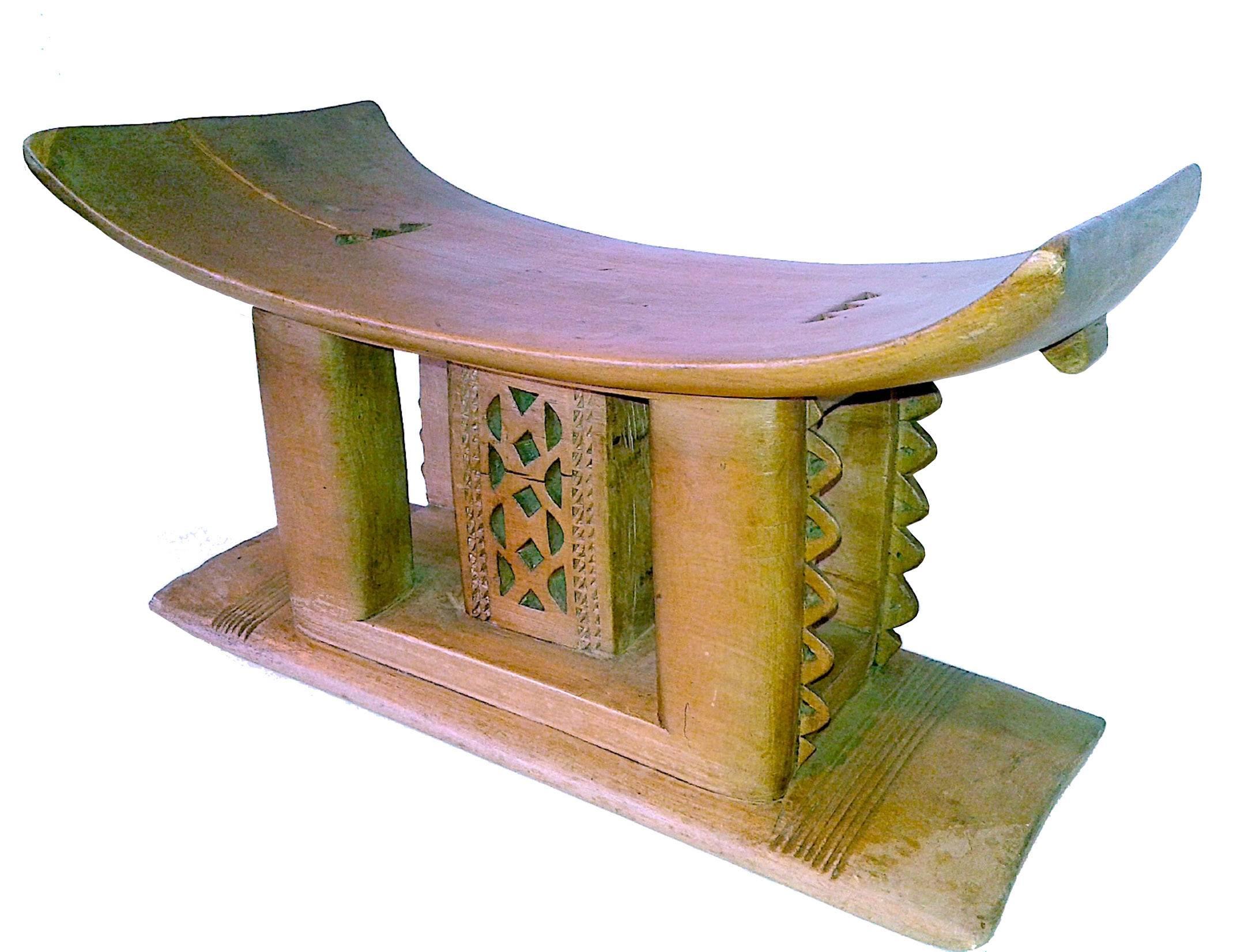 An Ashanti stool, traditional carved personal seat from Ghana. Carved from a single piece of wood. Use as a low end table, stand or seat.