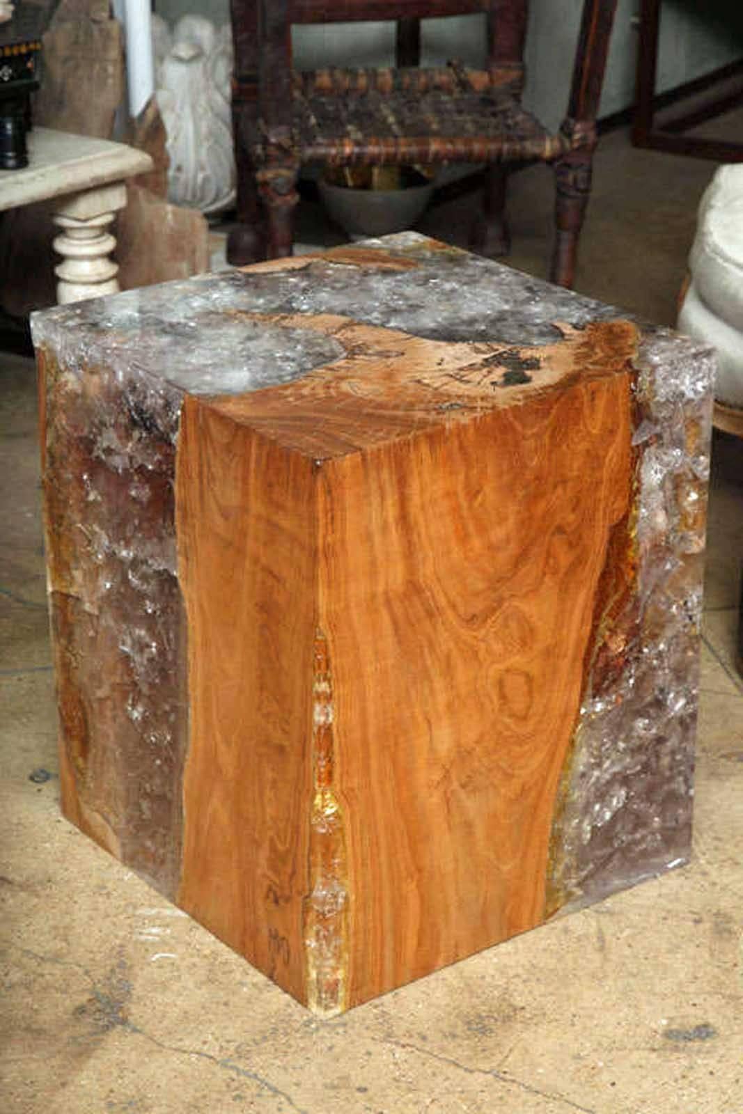 A selection of resin and teak wood side or end tables, in a natural wood finish. Contours of wood and curing of resin unique in each table. Also available in dark finish.
