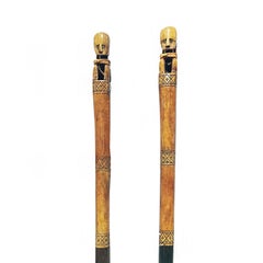 Two Hand-Carved Wood and Bone Batons on stand, Borneo, Late 20th Century