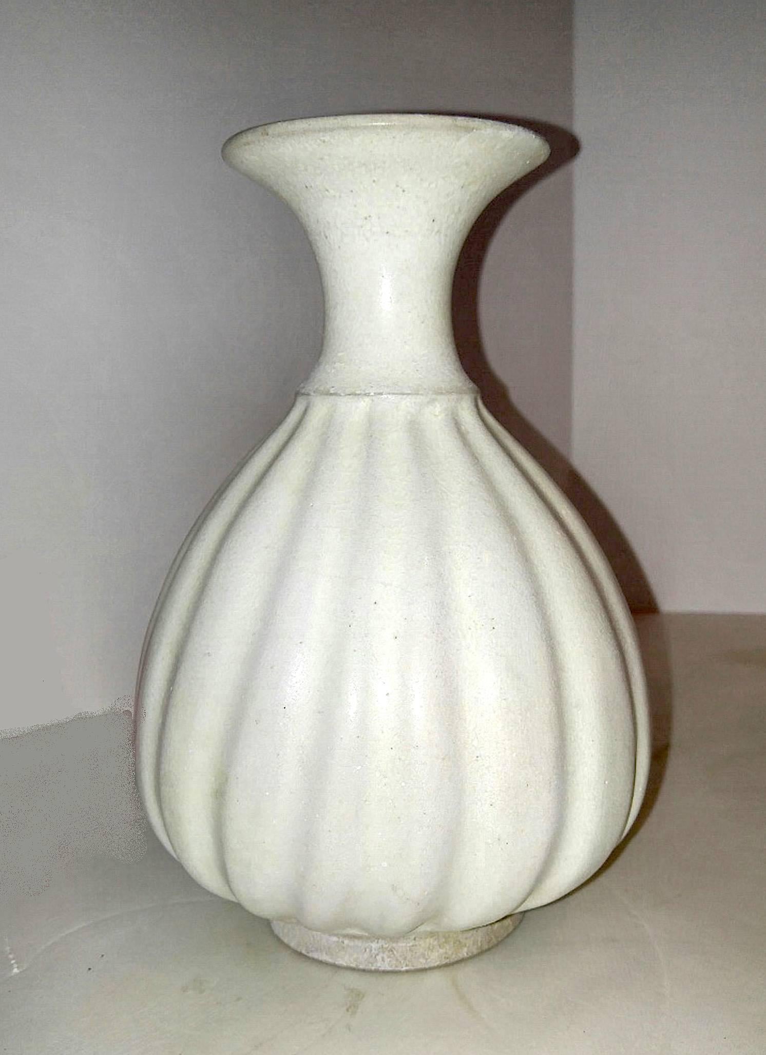 Ceramic vase in white glaze, from Thailand. Waved body, fluted neck. Excellent vintage condition.