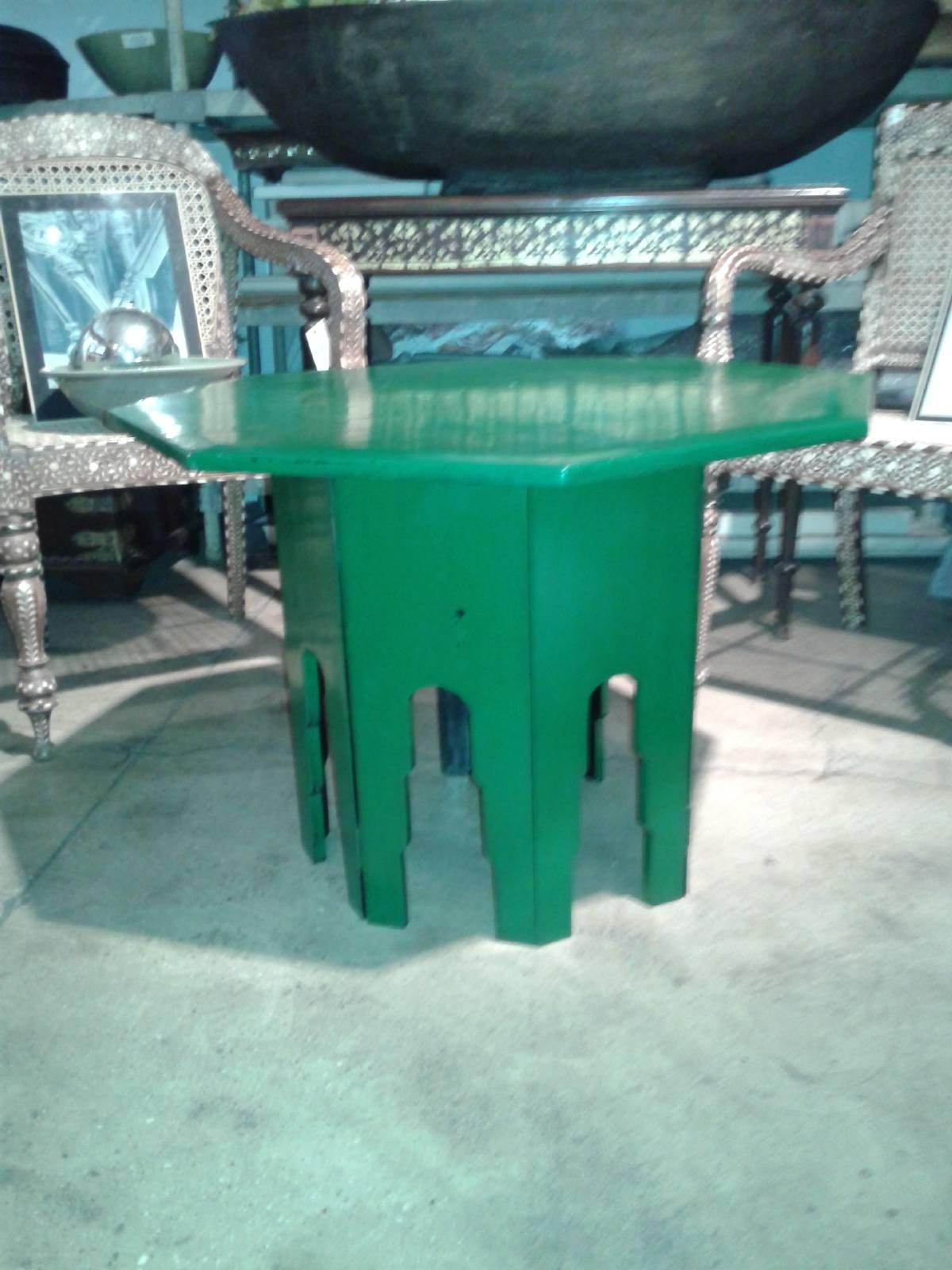 An octagonal green-lacquered side table / end table from Thailand. Hinged detachable  base, which can be folded for storage. Makes a fabulous accent to any room.  