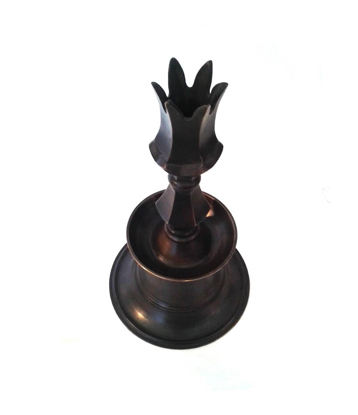 A solid brass candleholder from Turkey. Sturdy forged construction. Crown head. Measures: 15 1/4