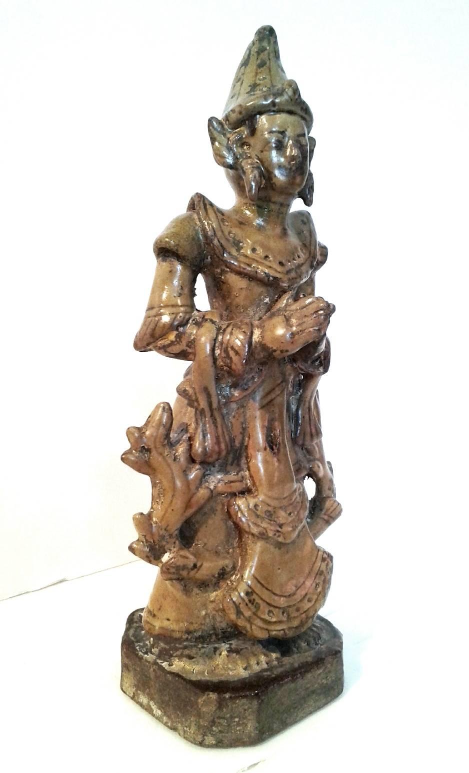A Thai angel statue made of solid ceramic, from old Burma (Myanmar). Intricate details and etching make this vintage piece a curiosity.