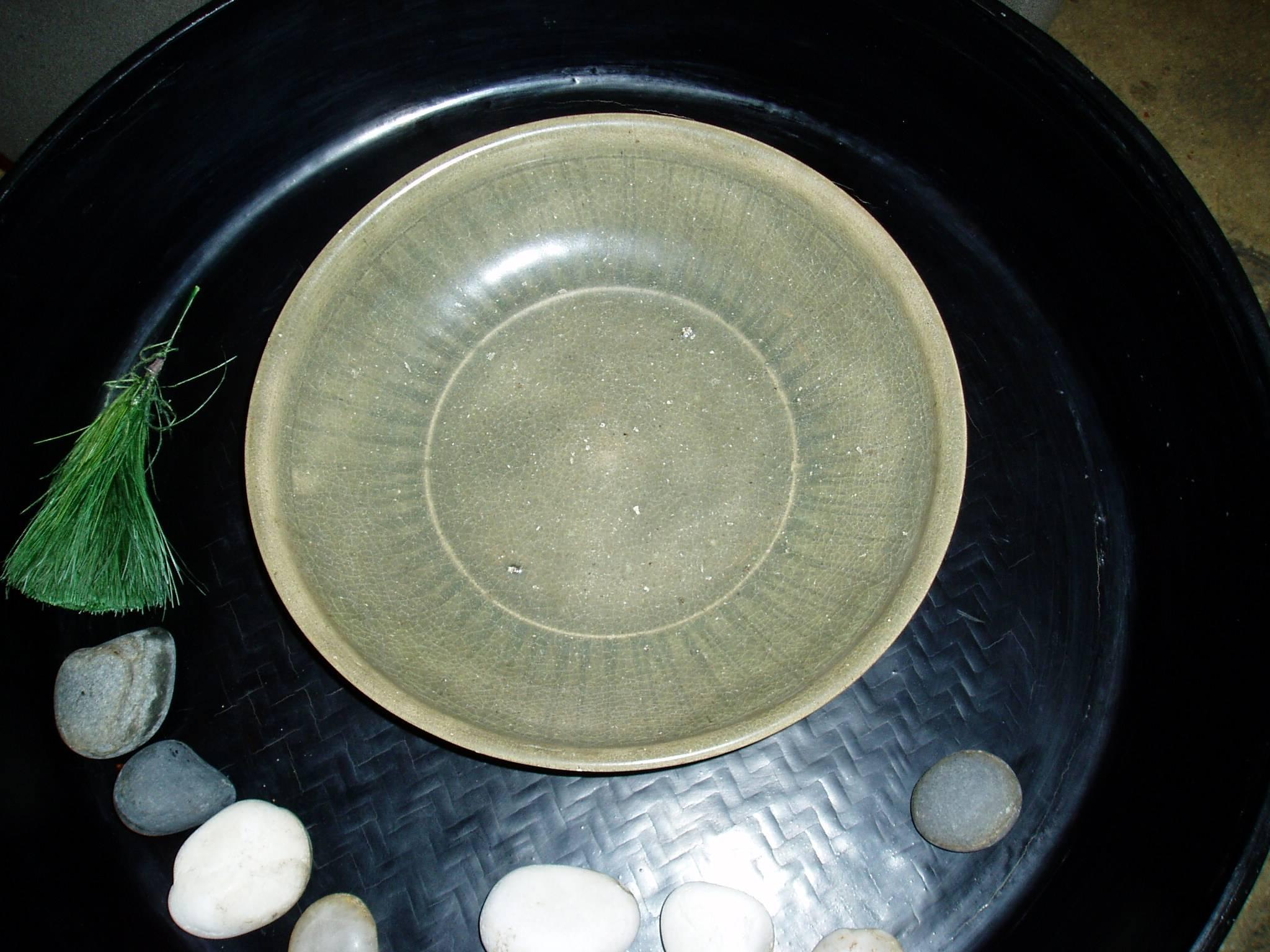 A ceramic plate from Myanmar (formerly Burma), finished in traditional Celadon glaze.