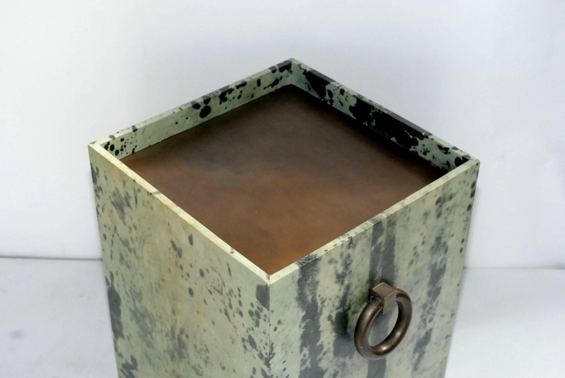 Pair of green and natural bleach parchment end tables with brass ring handles.