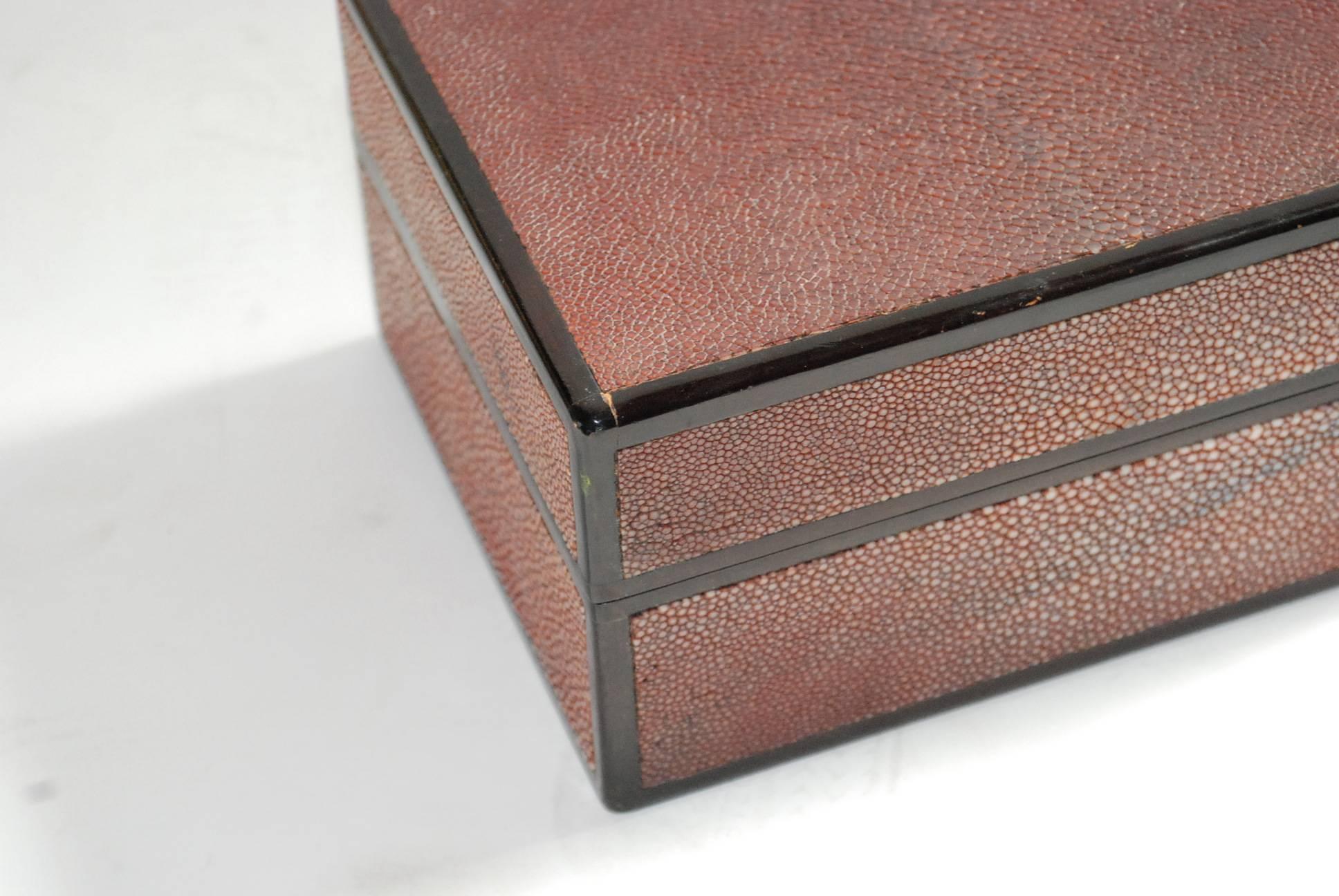 Shagreen covered box with black lacquered detail.