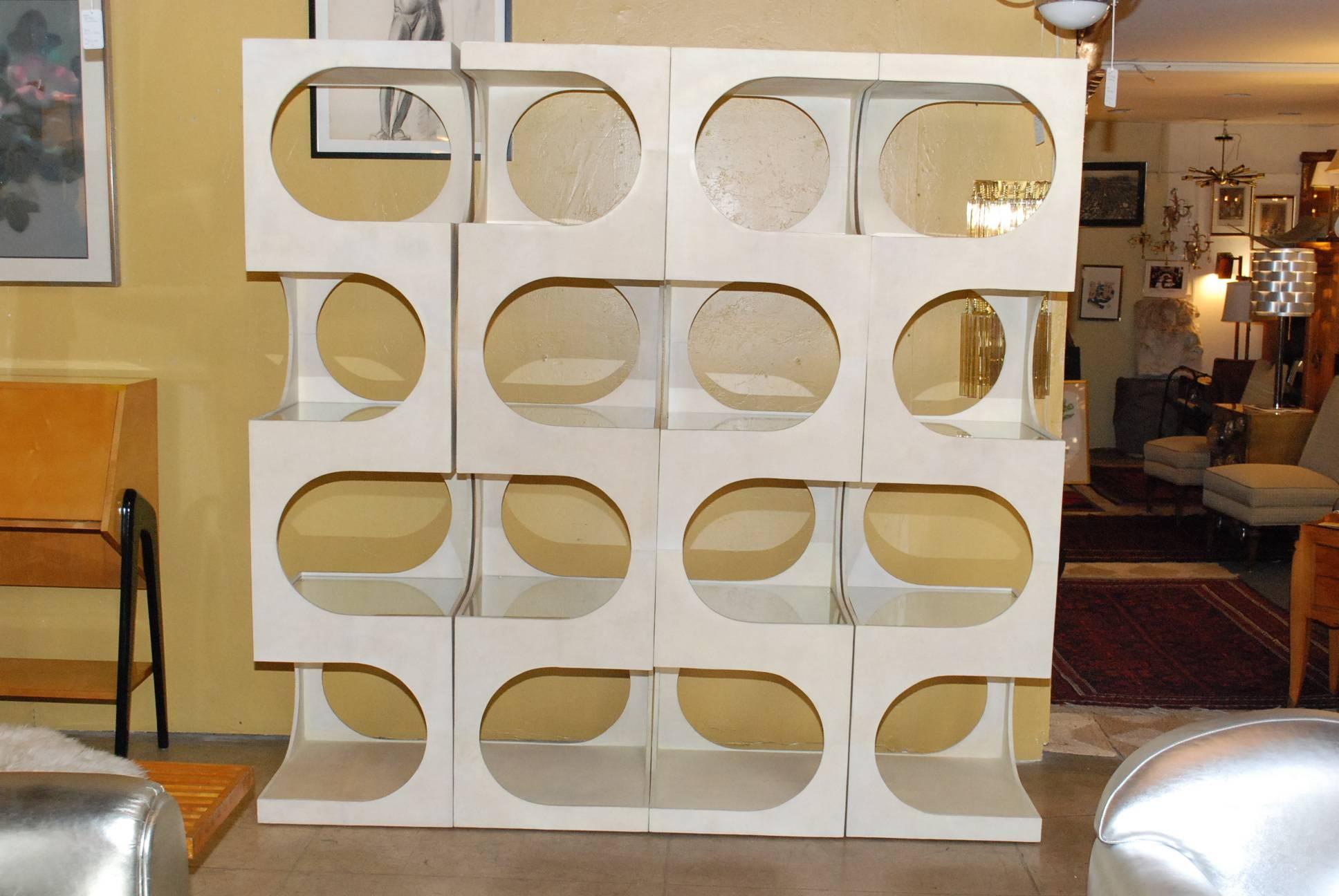Elegant Retro style ètagerè or room divider. This is four single unit cover all around of parchment and each Unit has four glass shelves.
Dimension: H 79