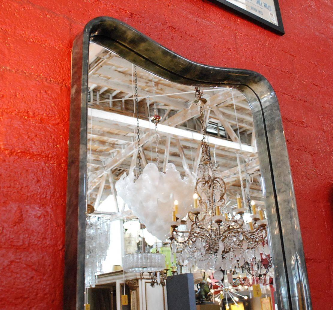 A beautiful parchment mirror. Parchment is in varying shades of grey. (High gloss polyester resin filled finish).
 