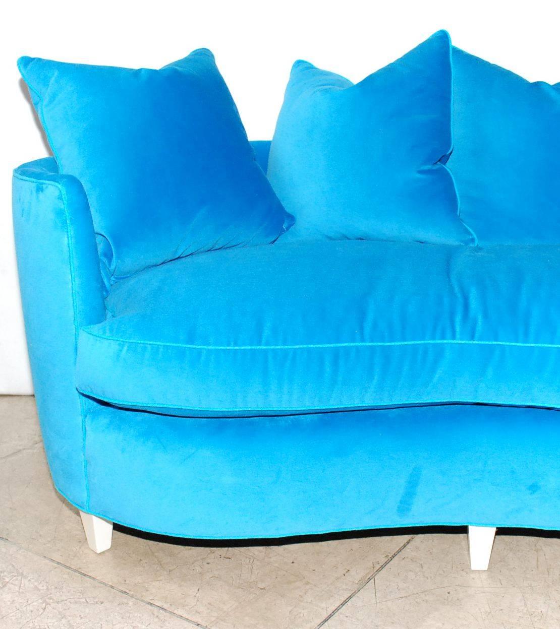 Elegant Henredon sofa newly upholstered with white lacquer legs.