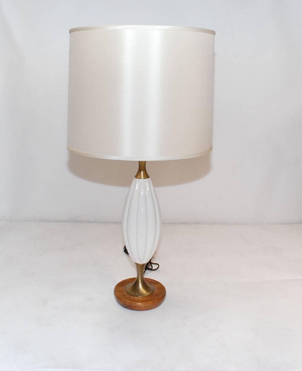 Elegant pair of 1960s white ceramic with brass and wood details.