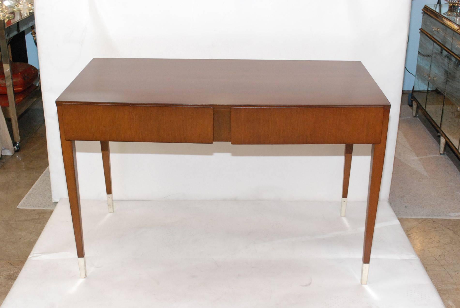 Rare 1940's walnut and oak two drawers and nickel-plated feet desk design by Gio Ponti, (1891-1979).

Gio Ponti, byname of Giovanni Ponti (born Nov. 18, 1891, Milan, Italy—died Sept. 15, 1979, Milan) Italian architect and designer associated with
