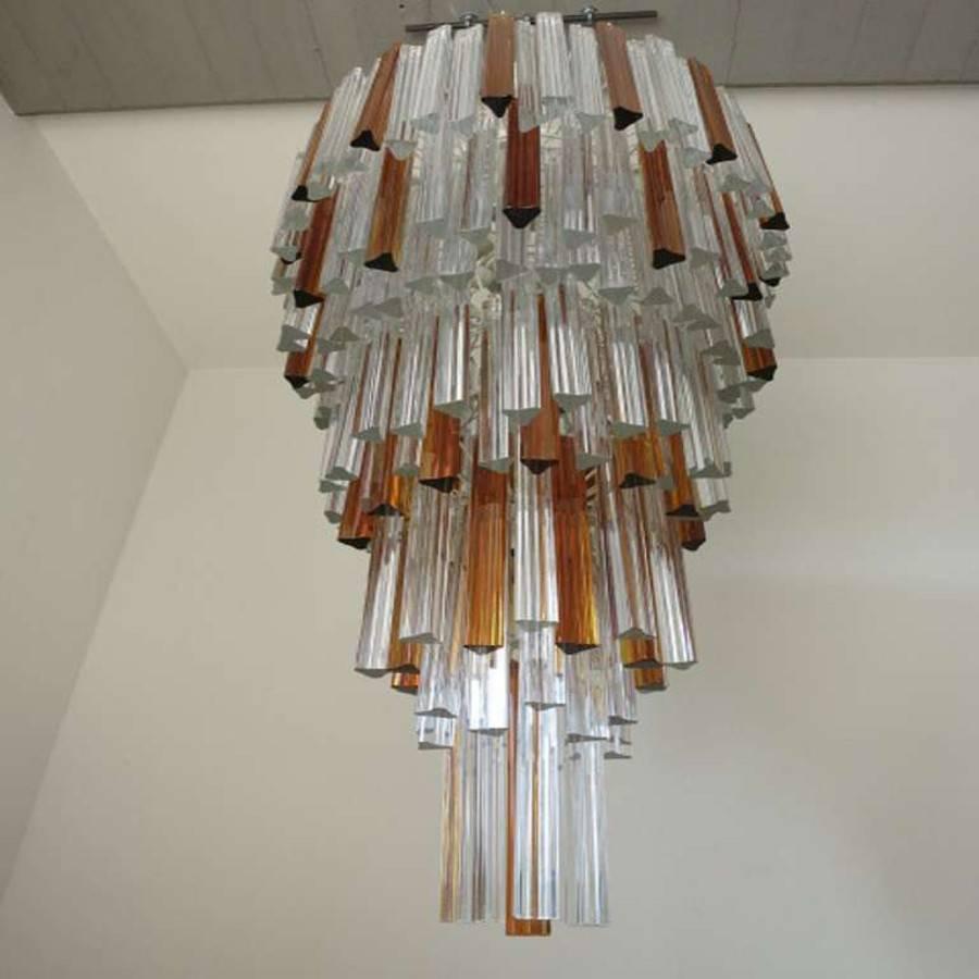 A Venini clear and amber Murano glass triedri chandelier. Has 21 lights. Height provided is for fixture only (chain and canopy extra).