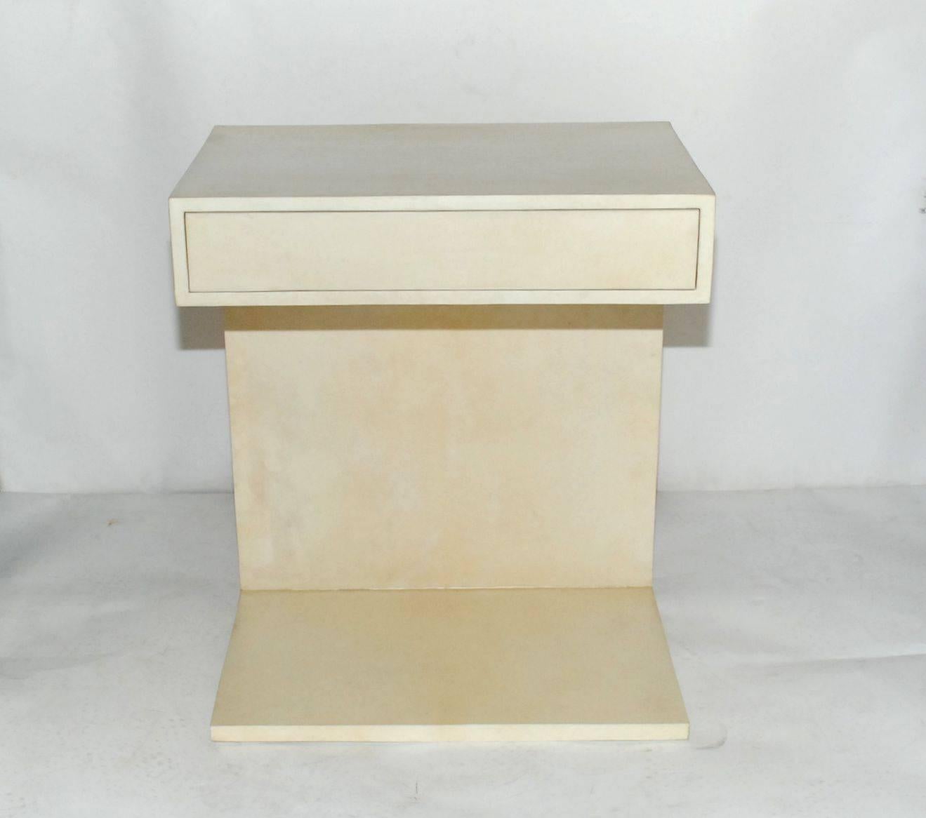 Pair of elegant large side tables or nightstands cover front and back with natural goatskin. Each table has single drawer.