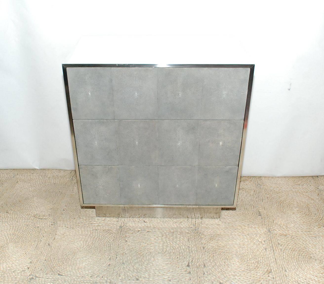 Pair of steel chest of drawers cover with light grey shagreen. (Three drawers).