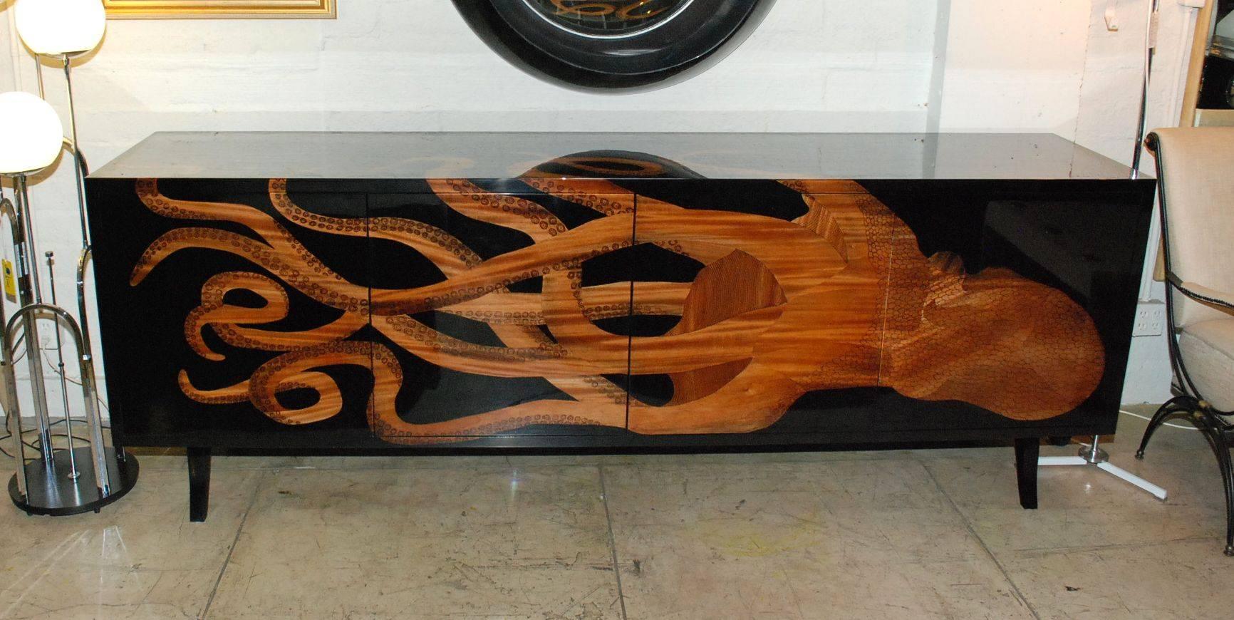 Elegant custom four doors with glass shelves sideboard. Exotic wood inlay octopus design.
