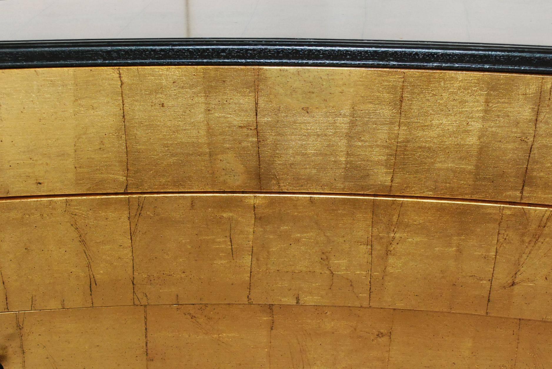 Elegant three drawers curved Louis XVI style commode cover with metallic gold leaf.
Please note: Minor scratches on gold leaf see detail pictures.