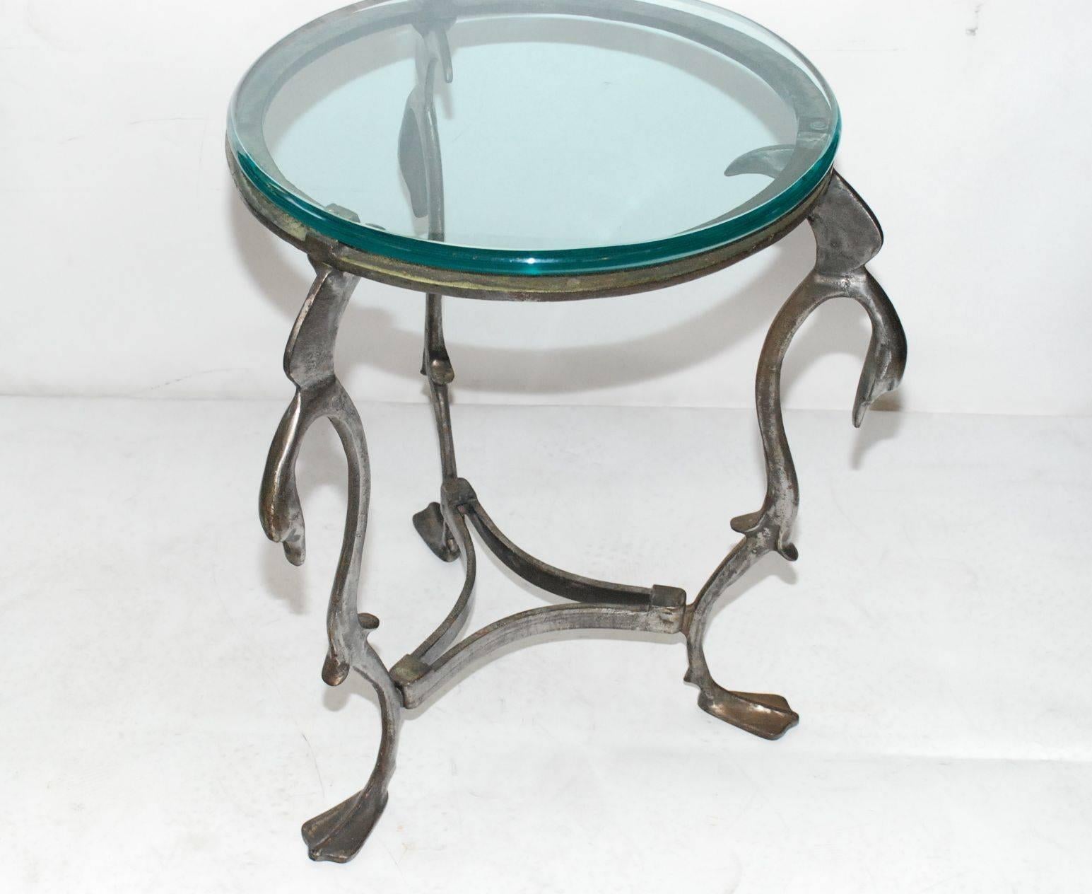 Antique finish three-legged swan occasional table made of iron. Topped with a round 1
