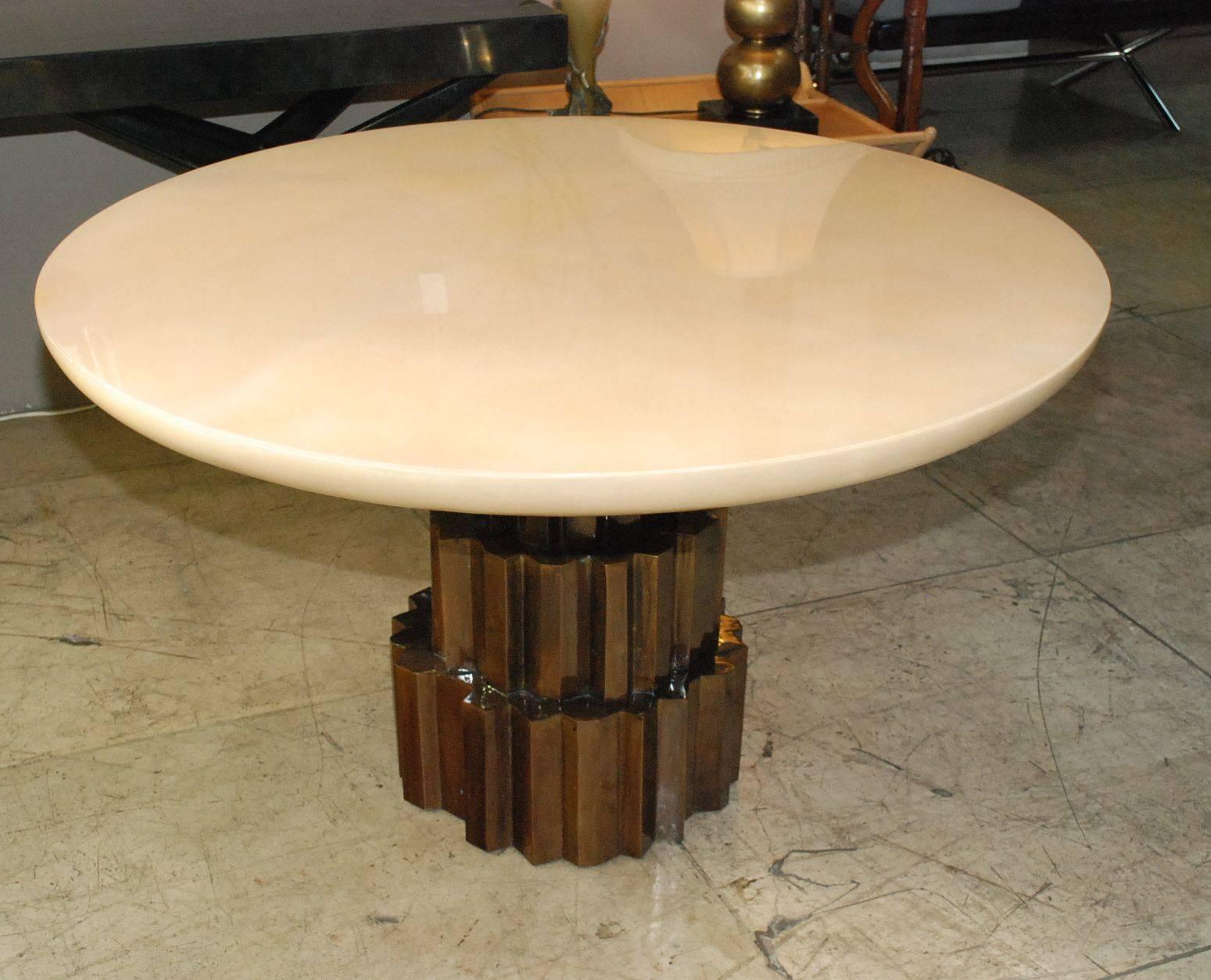 Elegant sculptural round center or dining table cover with copper and goatskin.
(High gloss polyester resin filled finish).