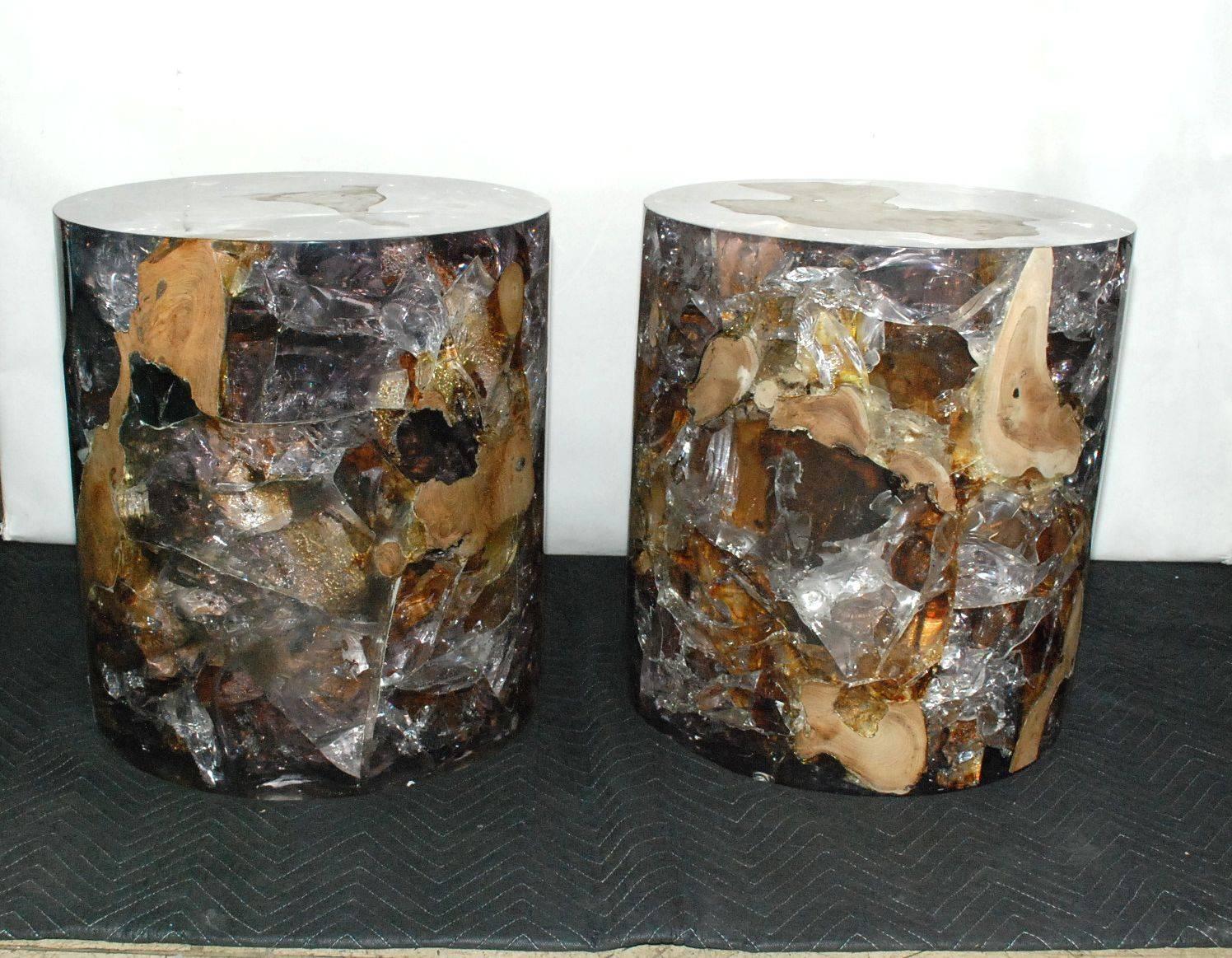 Pair of round side tables made of teak wood and clear resin. Each table is unique.