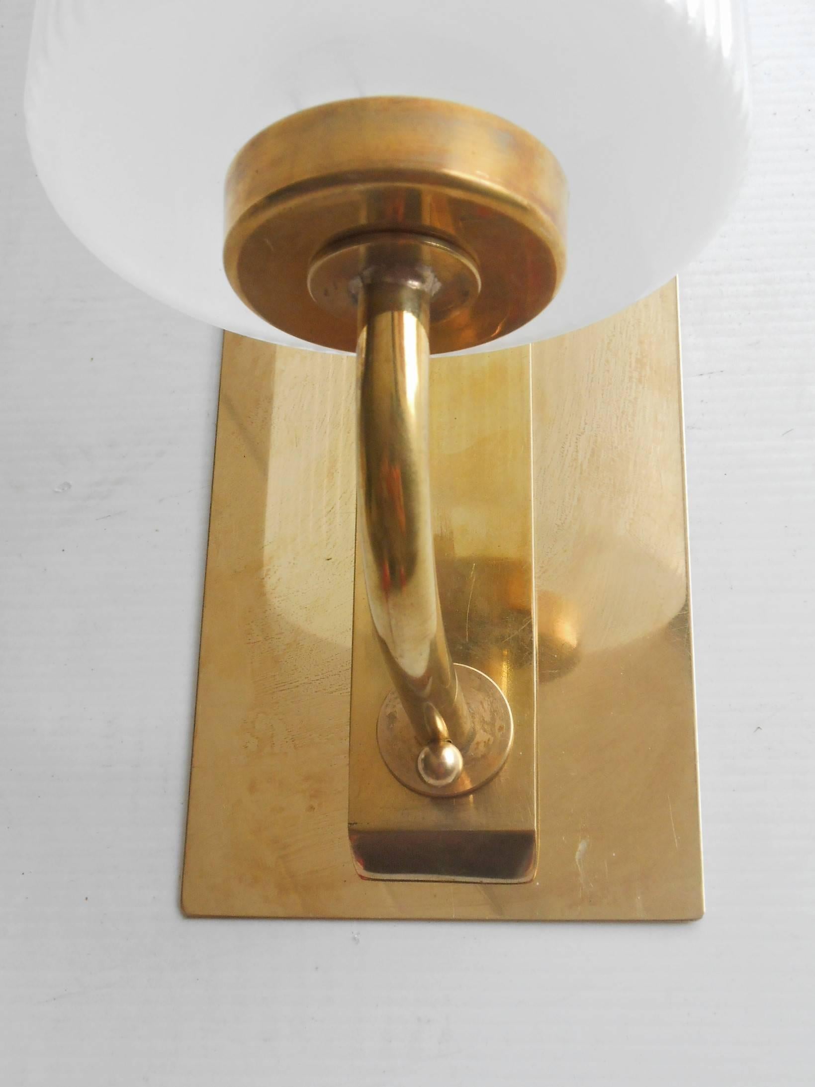 Pair of Murano frosted glass and brass sconces in the style of Stilnovo.