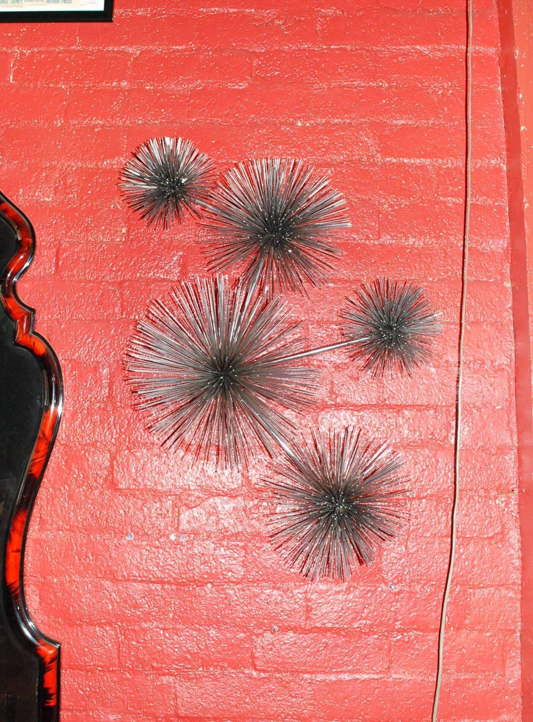 Elegant chrome-plated five urchin or pom pom wall sculpture signed Curtis Jere
Note: Sculpture can hang in horizontal or vertical.