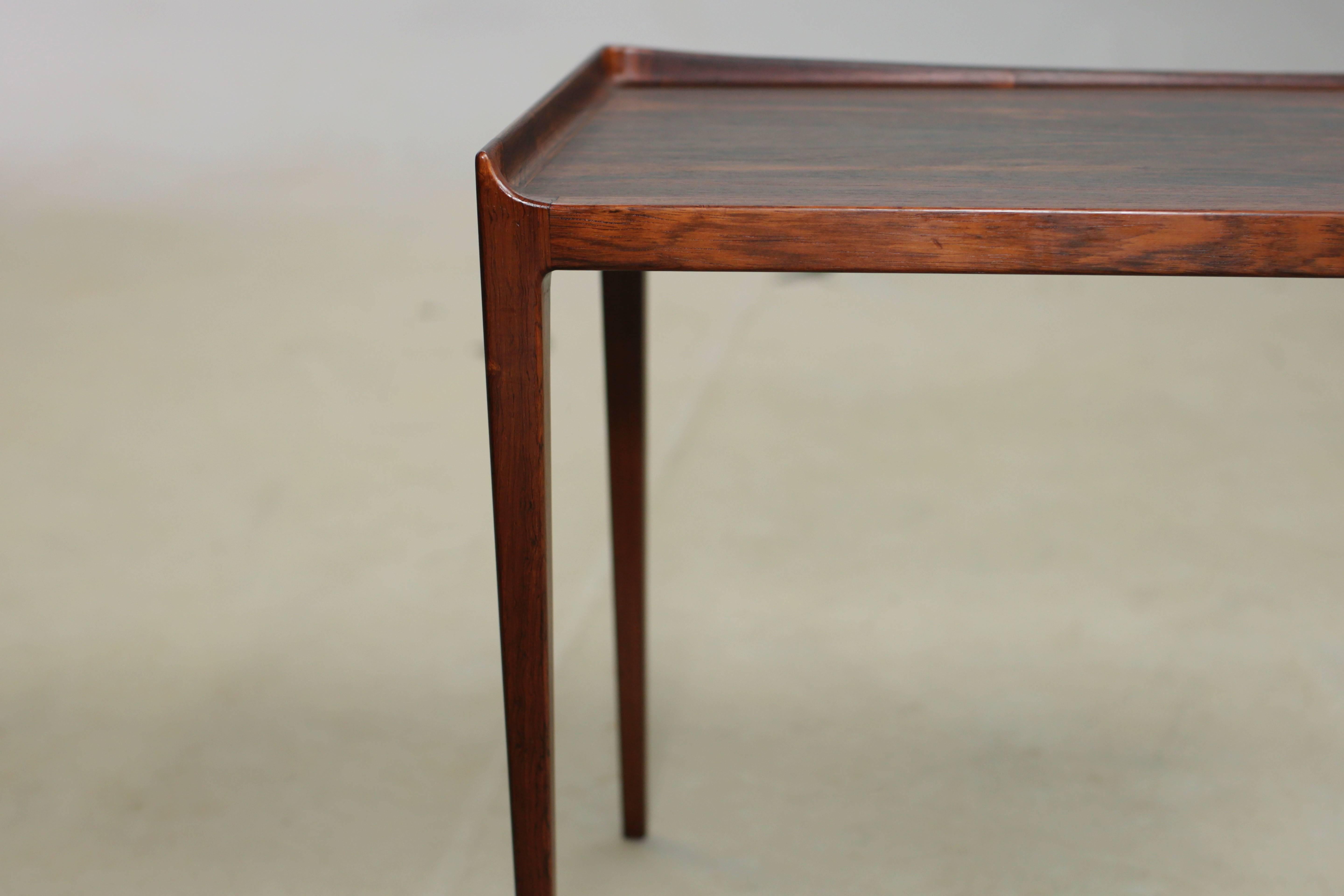 Vintage, 1960s, Kurt Ostervig nesting tables.

This set of rosewood nesting tables are in like-new condition. Having small extra tables can be a party saver. The each small table is 17" H x 14" W x 14" D. Ready for pick up,