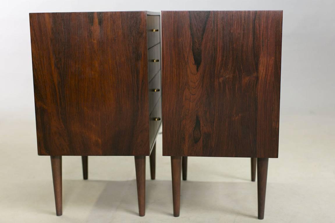 Vintage 1960s Danish rosewood nightstands.

These Mid-Century bedside tables are in like new condition. Modular so you can also push them together and use them as a dresser. Ready for pick up, delivery, and shipping anywhere in the world.
 