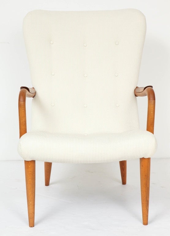 Vintage 1950s Wing Back Chair

This Wing Back Chair is not only stylish but extremely cozy. The design features Conical Legs, Button Tufting , Organic Arms with Layered Armrests.
Newly upholstered in a lovely Ivory Cotton Fabric. We also provide