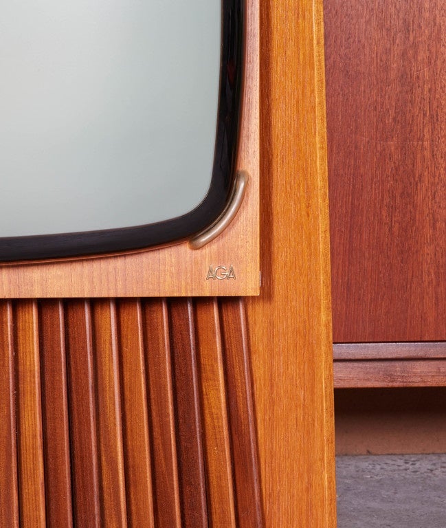 Vintage 1950s Console TV

This wonderfully designed Television has a beautiful Teak wood Frame. It is no wonder it is named the Prism, a look at the side view gives you a glimpse into how it was named. This TV most likely not functioning, would