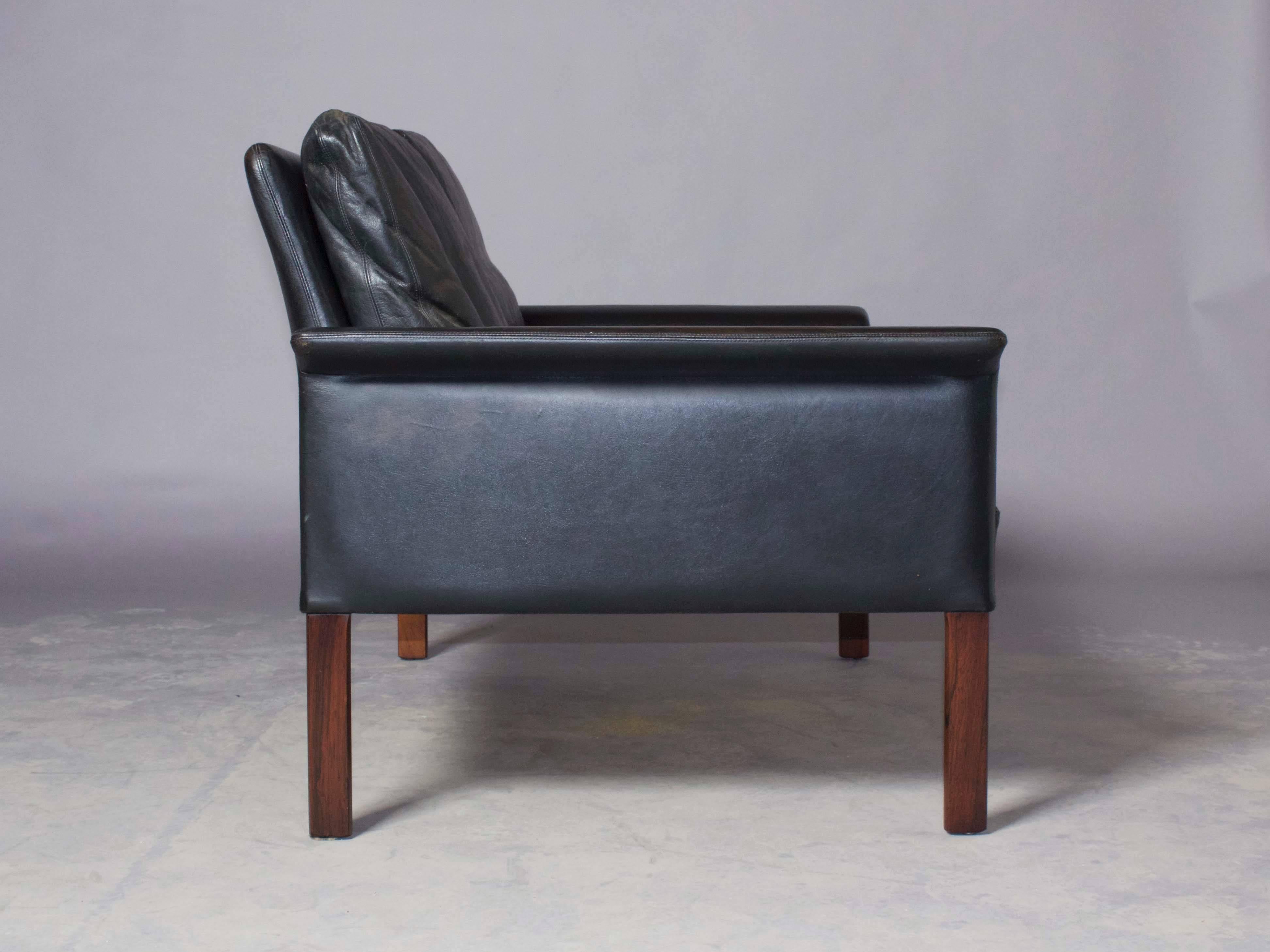 Vintage 1960s Leather Settee by Hans Olsen

This Danish loveseat is in amazing condition. The leather is broken in just right and the cushions are filled with feather and down. The legs are solid rosewood, and fits in just about any corner or nook