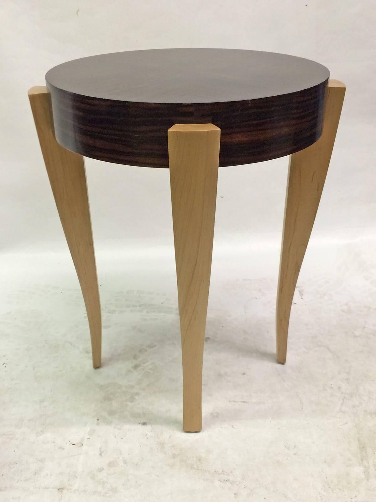 An elegant four legged entry/side table finished with sycamore legs and Macassar veneer on the top.