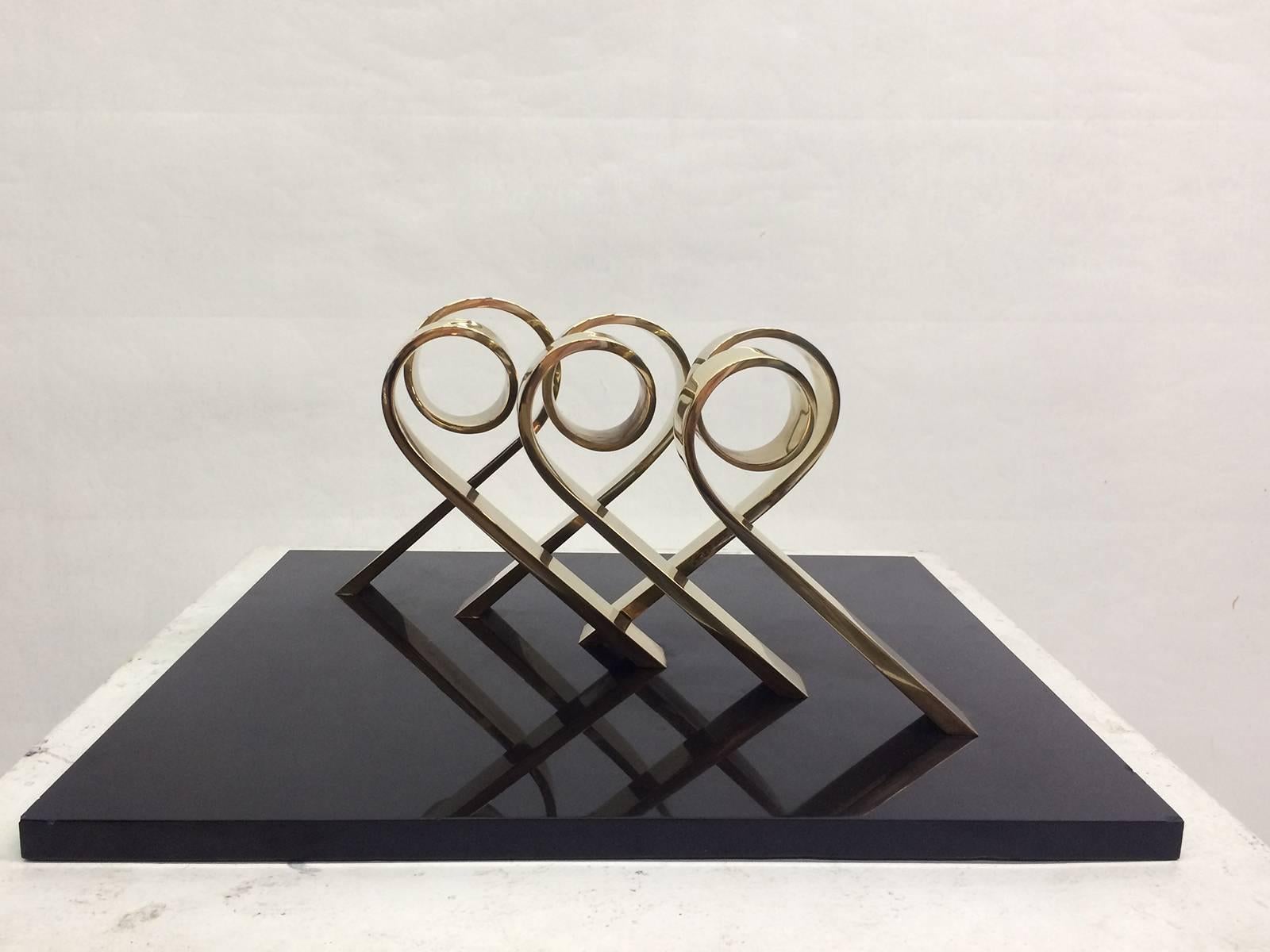 This bronze sculpture by important artist: Peter Chinni, from 1968, is a modern abstract sculpture. The reflective surface of the twist and base produces an element of interaction for the viewer. Signature, date, and edition 2/8 inscribed. 
Peter