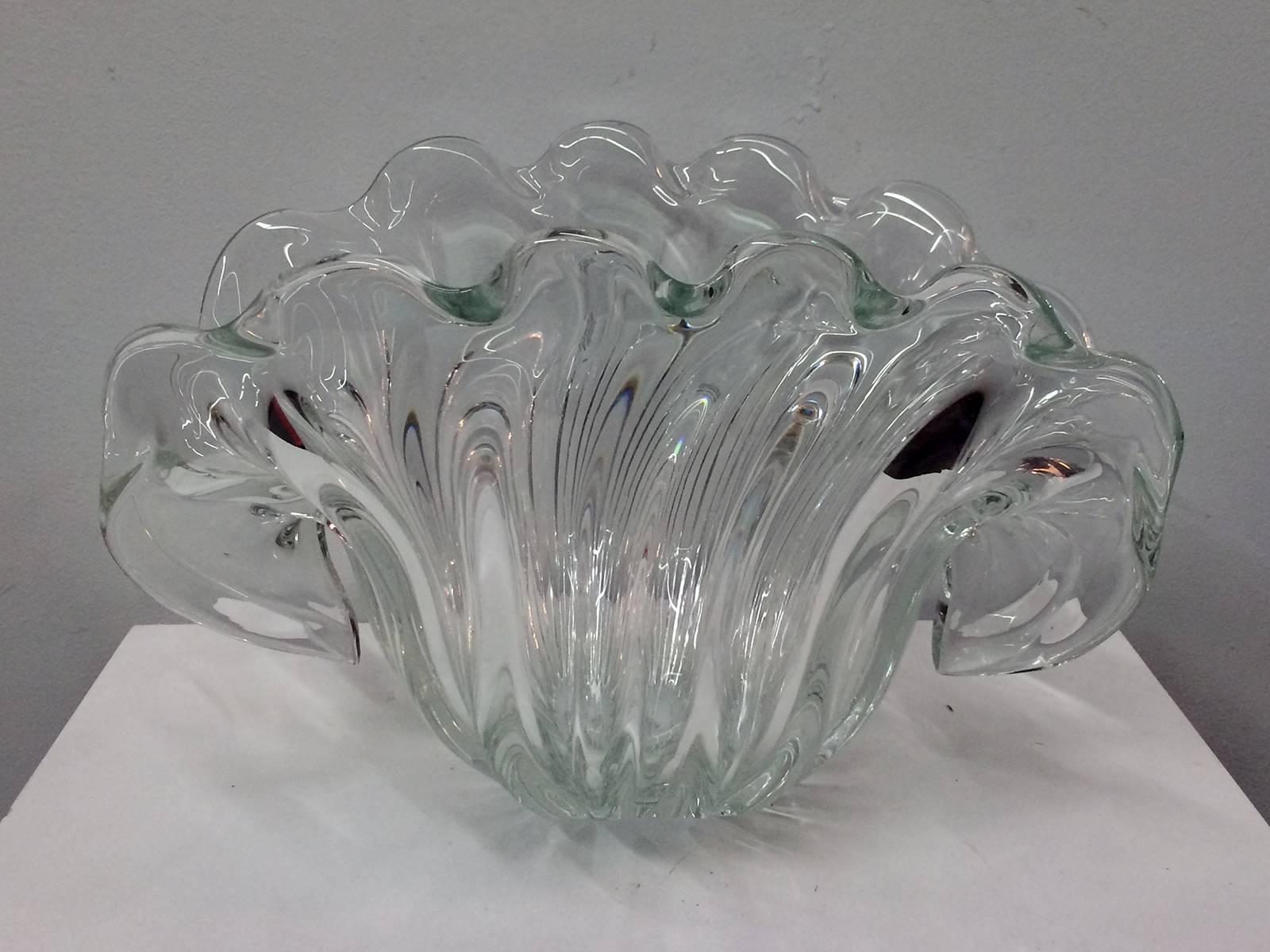 Vintage Italian Murano mouth blown glass clam shaped bowl by Venetian Company Formia. This interesting piece has two possible resting positions. The bowl rests comfortably on its base in a vertical position and then also at a 45- degree angle on a