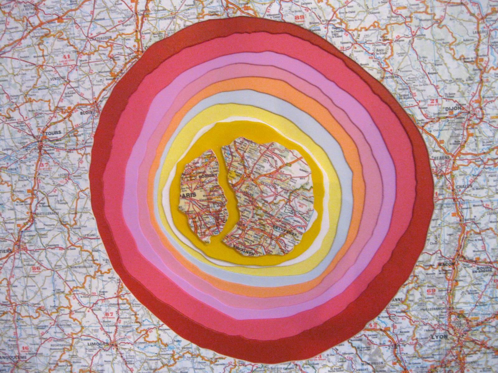 This mixed-media painting is composed of layers of receding painted card-stock producing an image in relief. The technique gives the piece a topographical, geological or planetary effect. The warm red, yellow and pinks stand in contrast to the