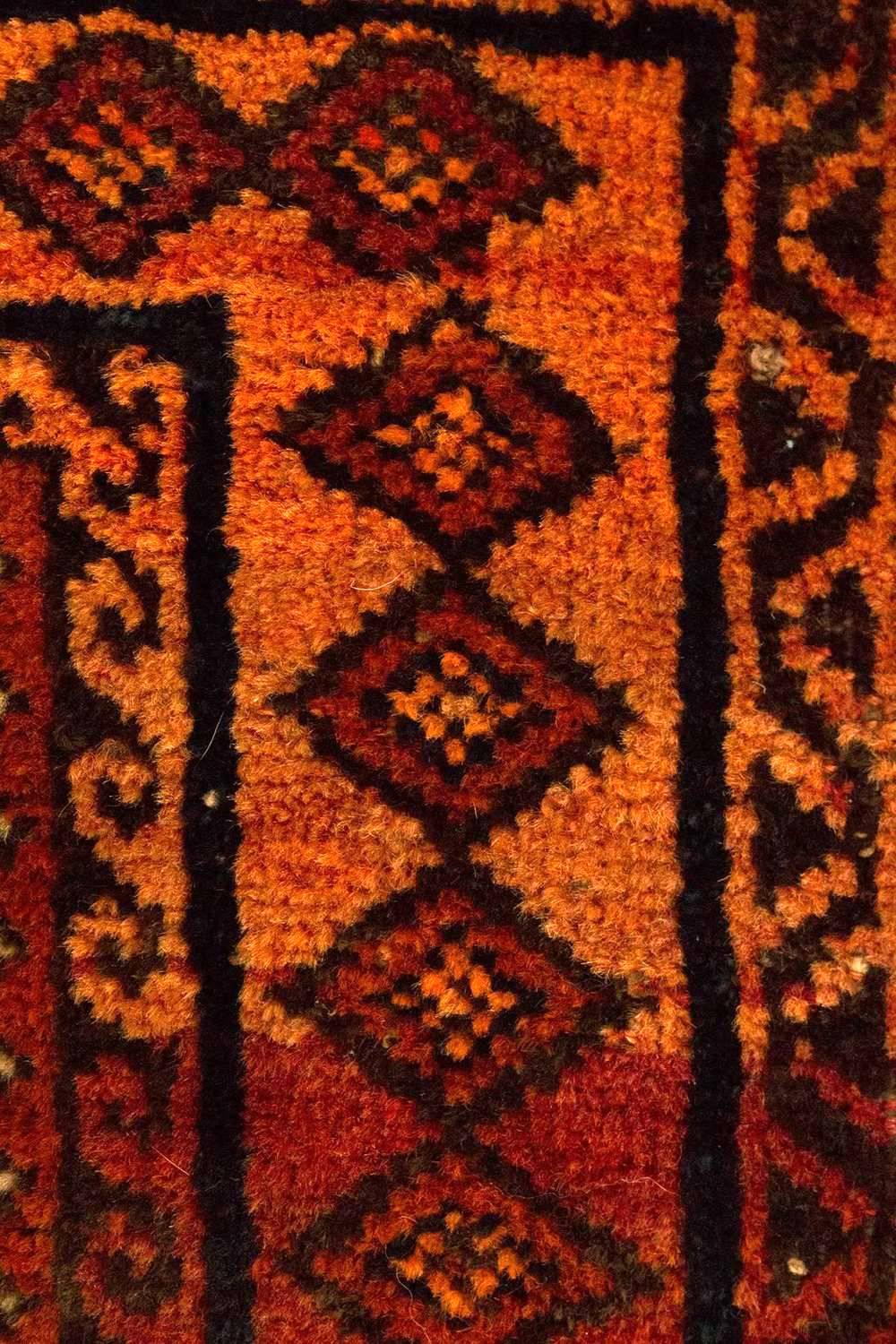 This tapestry is from Eastern Persia, woven by one of the tribal groups generally referred to as Baluch. This rug reflects all their characteristics: deep saturated colors, highly stylized geometric designs, wool construction and the handle of the