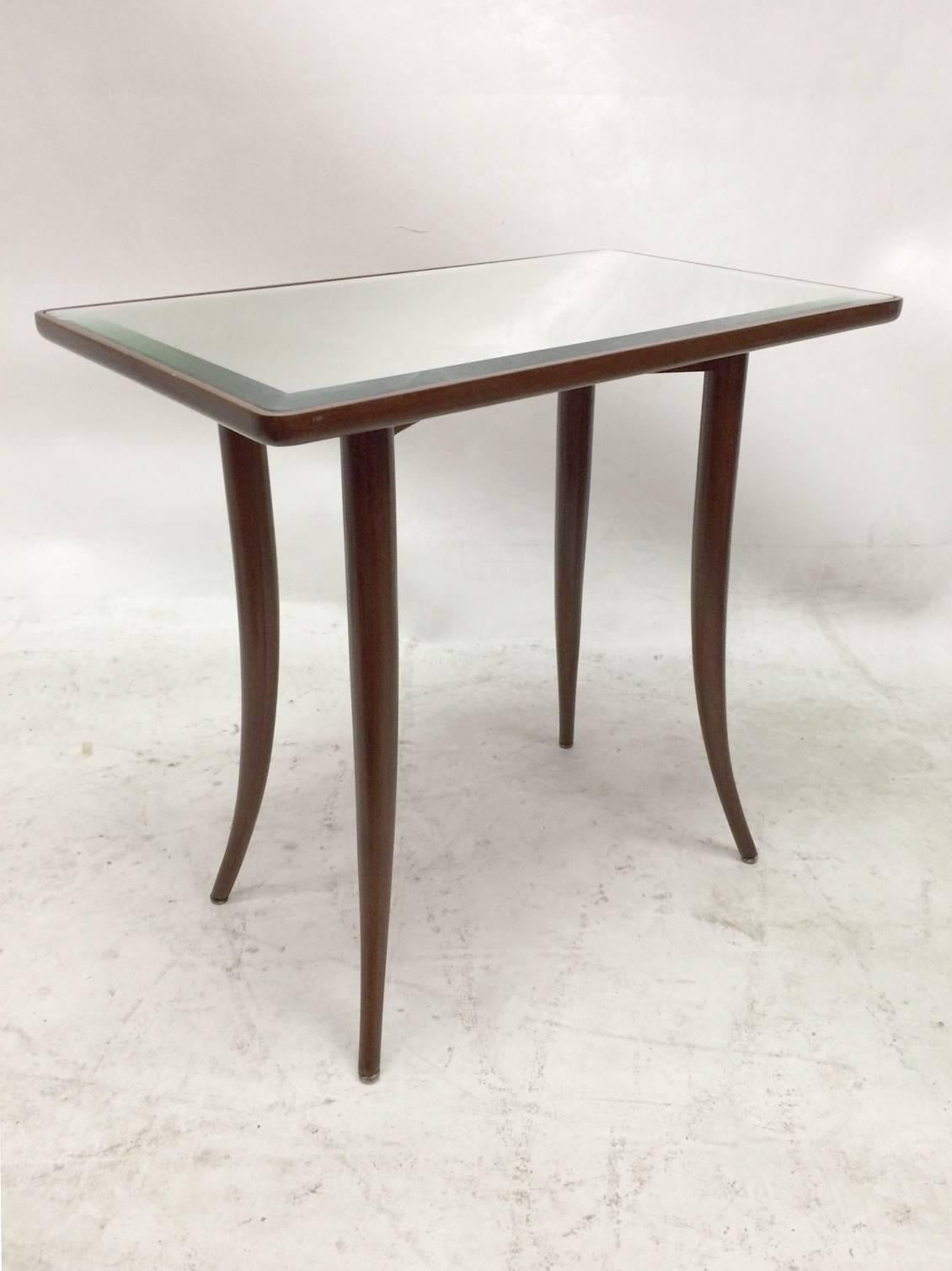 This is a stunning pair of side tables with klismos legs and mirrored tops. The tables have bent-wood mahogany legs and a recessed top for the mirrors.