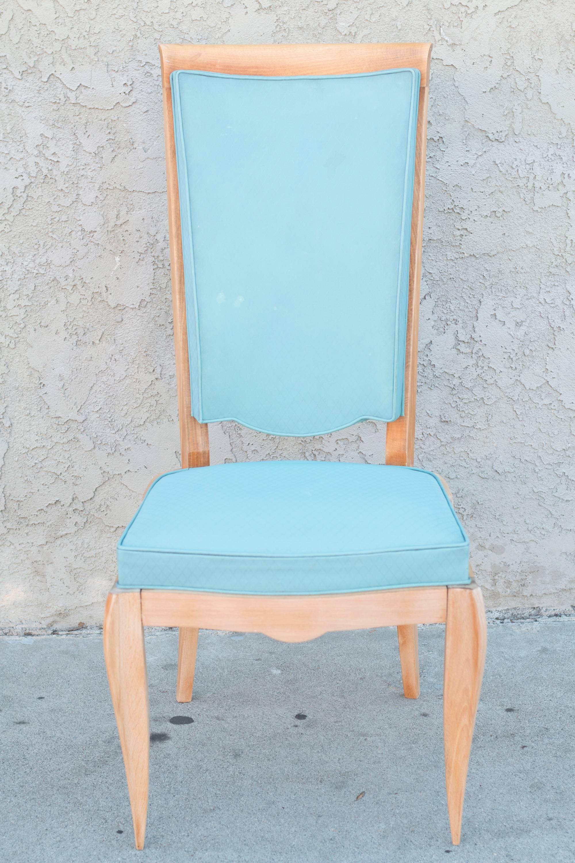 Set of eight dining chairs in the manner of Jean Pascaud.
They have their original turquoise vinyl upholstery and their wood needs to be revarnished.
They are very comfortable because they have a deeper seat than usual French chairs.
They are