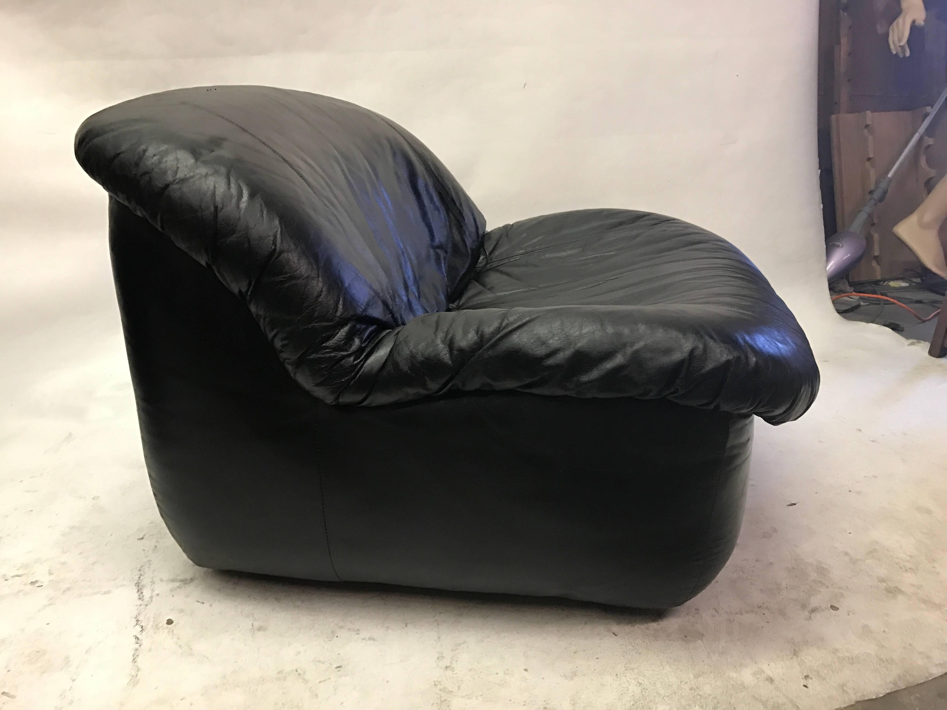 Pair of comfortable Italian black leather slipper chairs.  Seat depth measures about 21 inches.