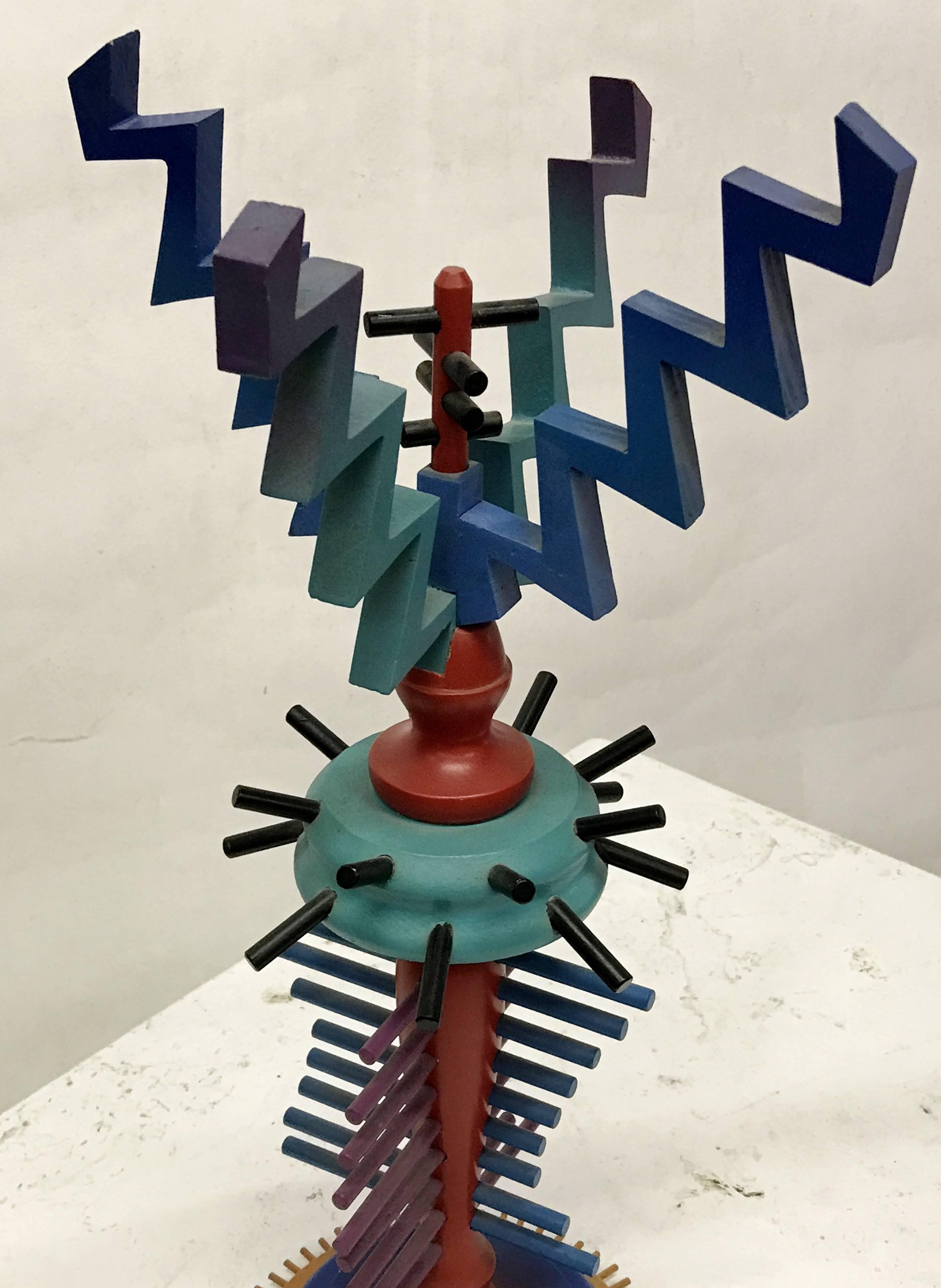Colorful sculpture in the 1980s Memphis style attributed to Max Finkelstein. Sculpture is lightweight and made up of painted wooden geometric shapes. Acquired directly from the late artist's estate.