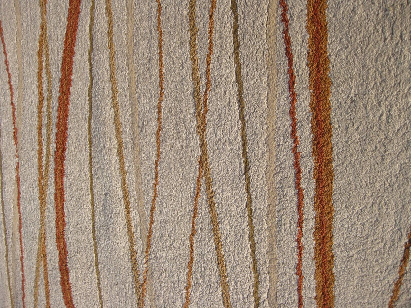 beige and rust area rug