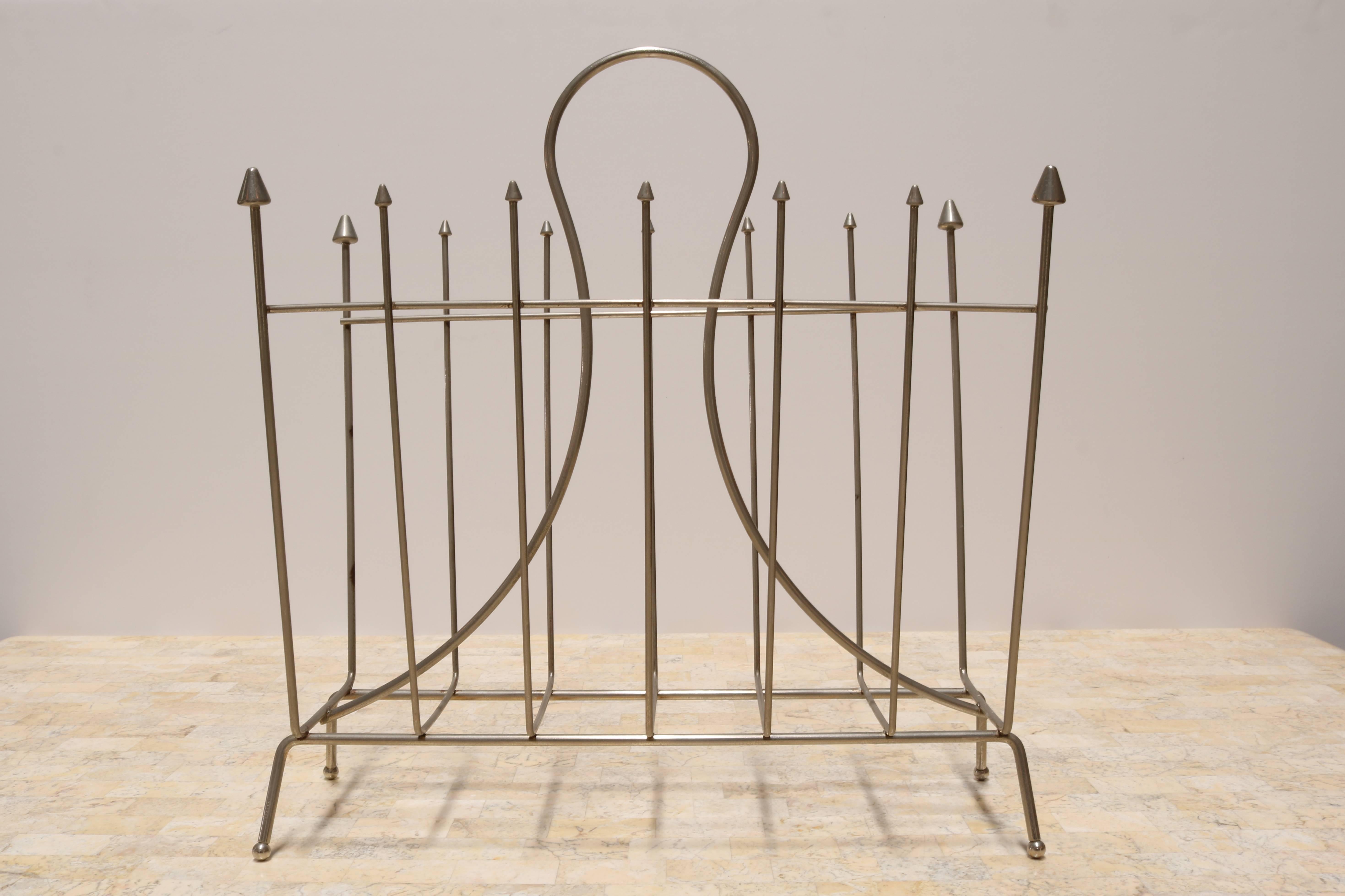This magazine rack is composed of steel arrows.